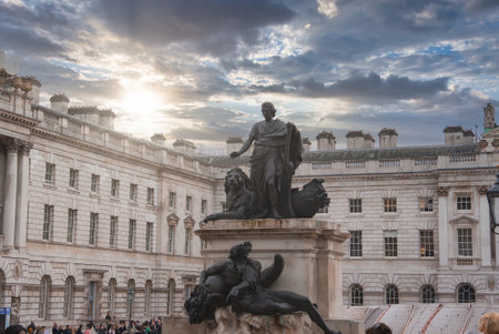 Statue and Somerset House Courtyard with Dramatic Sky in London