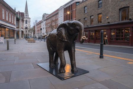 Bronze Elephant Sculpture on a Pedestrian Street in Londonの写真素材