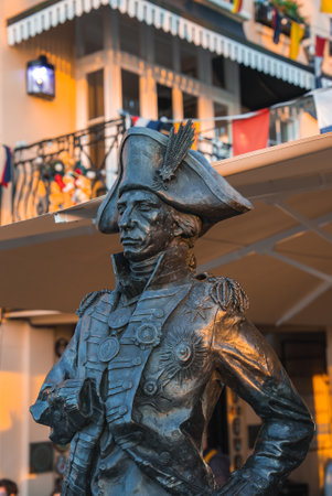 Bronze Statue of Historical Figure in Naval Uniform at Golden Hourの写真素材