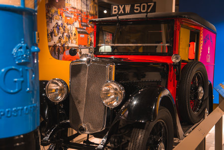 Vintage British Postal Vehicle and Blue Postbox in Museum Exhibit