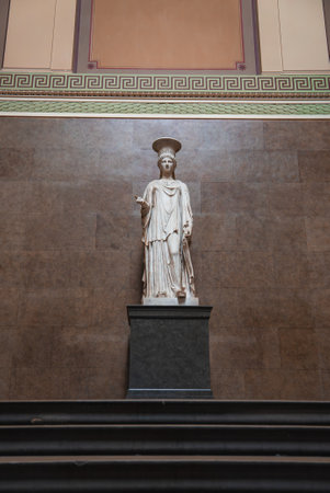 Classical Marble Statue in Museum with Greek Key Wall Patternsの写真素材