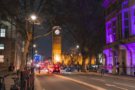 Nighttime Street Scene in London with Big Ben in the Backgroundの写真素材