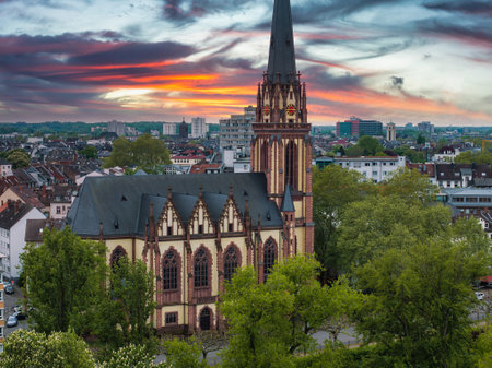 Aerial View of Dreikonigskirche and Urban Landscape at Sunsetの写真素材