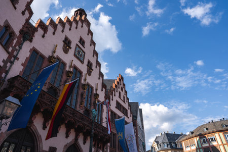 The Romer Building with Flags and Clock in Frankfurt, Germanyの写真素材