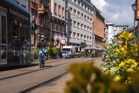 Lively Street Scene with Tram and Cyclist in Frankfurt, Germanyの写真素材