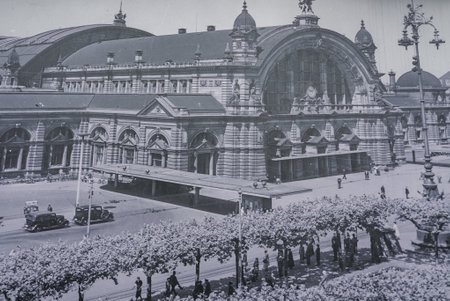 Frankfurt Central Station with Tree Lined Street and Vintage Cars