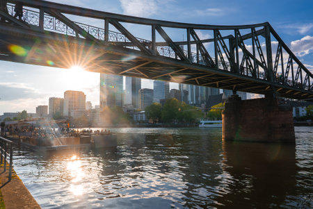Eiserner Steg Footbridge at Sunset with Frankfurt Skyline, Germanyの写真素材