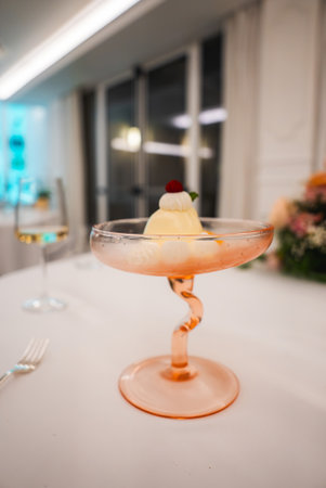 Elegant Dessert in Twisted Stem Glass at Fine Dining Table in Amalfiの写真素材