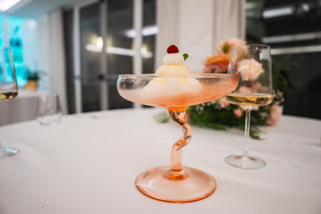 Elegant Dessert in Twisted Stem Glass with Raspberry and Mintの写真素材