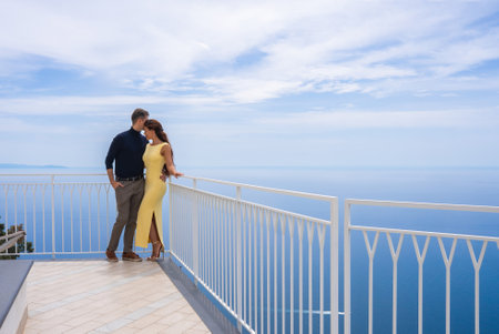 Couple on Terrace Overlooking Tyrrhenian Sea on Amalfi Coastの写真素材