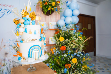 Colorful Celebration Setup with Decorated Cake and Balloons Indoorsの写真素材