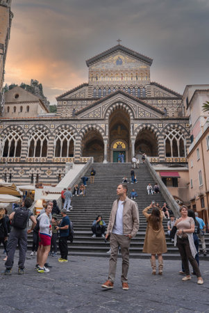 Amalfi Cathedral and Square at Sunset with Tourists and Activityの写真素材
