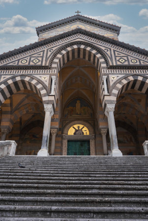 Facade of Amalfi Cathedral with Striped Arches and Golden Mosaicsの写真素材