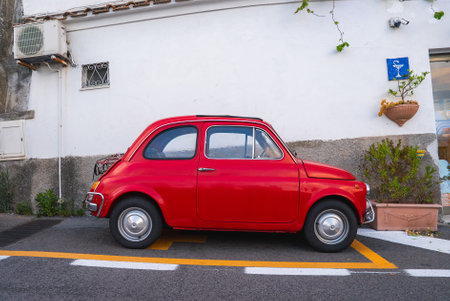Red Vintage Fiat 500 on a Narrow Street in Positano, Italyの写真素材