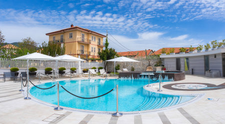 Luxurious Outdoor Pool Area with Lounge Chairs in Amalfi, Italyの写真素材