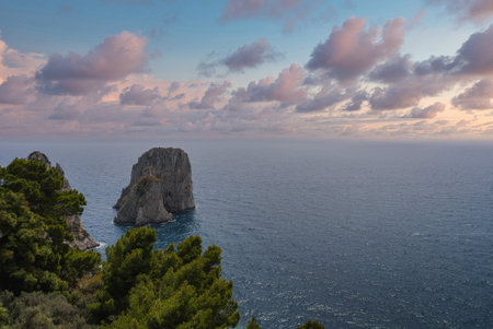 Coastal View of Capri with Faraglioni Rock Formations at Sunsetの写真素材