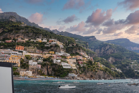 Positanos Colorful Hillside Buildings and Tyrrhenian Sea at Sunsetの写真素材