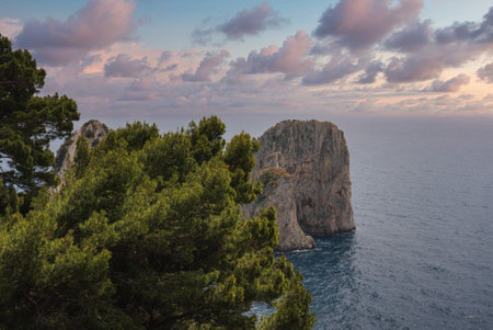 Coastal View of Capri with Sea Stack and Sunset Sky in Italyの写真素材