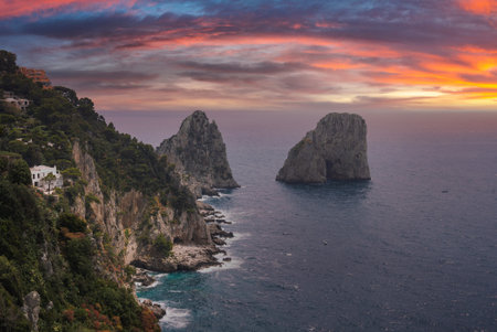 Faraglioni Rock Formations and Cliffs at Sunset in Capri, Italyの写真素材
