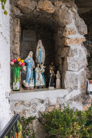 Religious Shrine with Virgin Mary Statues in Stone Alcove, Amalfiの写真素材