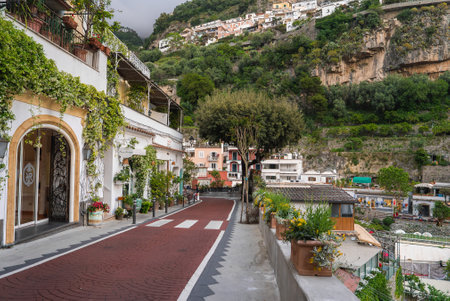 Street in Positano, Italy with Red Brick Pathway and Cliffside Viewの写真素材
