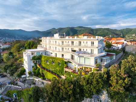 Luxurious White Hotel on Hillside with Panoramic Mediterranean Viewsの写真素材