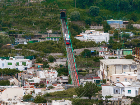 Red Funicular Railway Ascending on Capri Island, Italyの写真素材