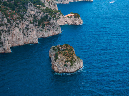 Coastal View of Capri Island with Cliffs and Orange Building