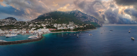 Capri Island Harbor with Yachts and Whitewashed Buildings at Sunset
