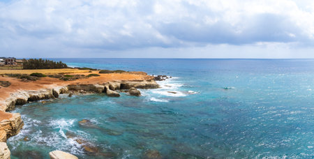 Coastal Cliffs and Turquoise Waters of the Mediterranean in Cyprusの写真素材