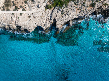 Aerial View of Rocky Coastline and Turquoise Waters in Limassol, Cyprusの写真素材