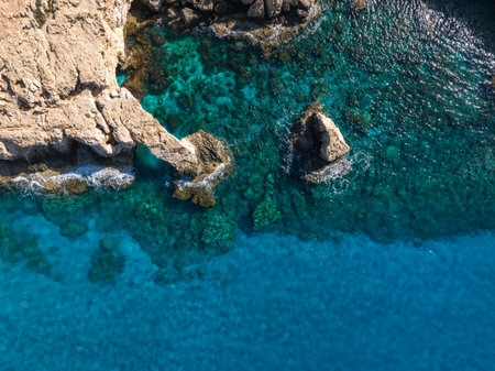 Aerial View of Rocky Coastline and Turquoise Waters in Ayia Napaの写真素材