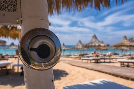 Close Up of Metallic Fixture on White Pole at a Cyprus Beachの写真素材