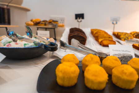 Buffet Display of Lemon Muffins, Turkish Delights, and Pastries