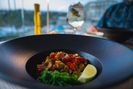 Close Up of Vibrant Dish with Vegetables and Lemon in Upscale Settingの写真素材