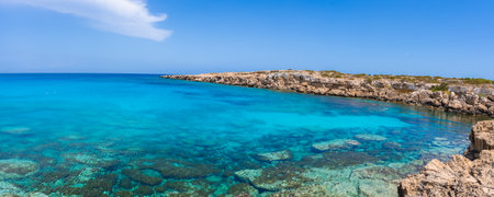 Coastal Scene in Cyprus with Turquoise Waters and Rocky Shorelineの写真素材