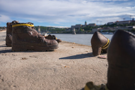 Shoes on the Danube Bank Memorial with Buda Castle and Chain Bridgeの写真素材
