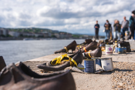 Shoes on the Danube Bank Memorial with Cityscape in Budapestの写真素材