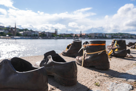 Shoes on the Danube Bank Memorial with Budapest Cityscapeの写真素材