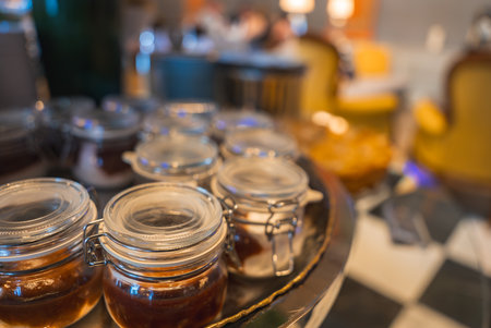 Close Up of Glass Jars with Preserves in a Luxurious Interior Setting