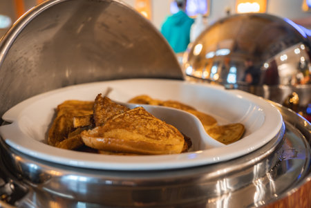 Buffet Setup with Pancakes in a Luxury Boutique Hotel Dining Areaの写真素材