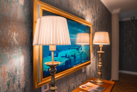 Luxurious Interior with Gold Framed Painting and Wooden Console Tableの写真素材