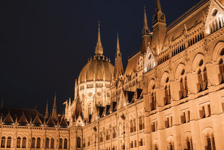 Hungarian Parliament Building Illuminated at Night in Budapestの写真素材