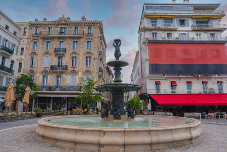 Charming Square with Fountain and Classic Architecture in Cannes, Franceの写真素材