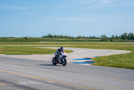 Motorcyclist Racing on Sports Bike at Track with Sharp Curves