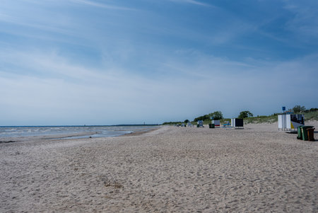 Sandy Beach with Beach Huts and Calm Waters in Parnu, Estoniaの写真素材