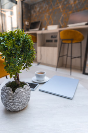 Modern Workspace with Mustard Barstools and Geometric Wall Designの写真素材