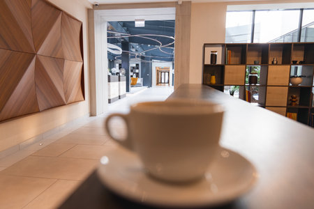 Modern Hotel Interior with Wooden Wall Art and Large Windowsの写真素材