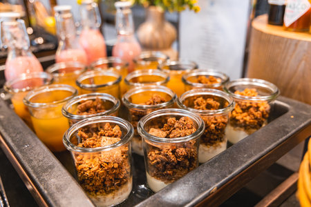 Luxurious Breakfast Display with Yogurt, Granola, and Juicesの写真素材