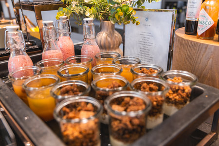 Elegant Breakfast Station with Desserts and Beverages in Luxury Hotelの写真素材